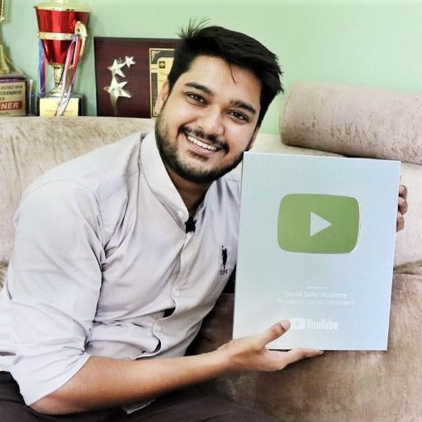 Lakshit Sethiya holding his YouTube Creator Award