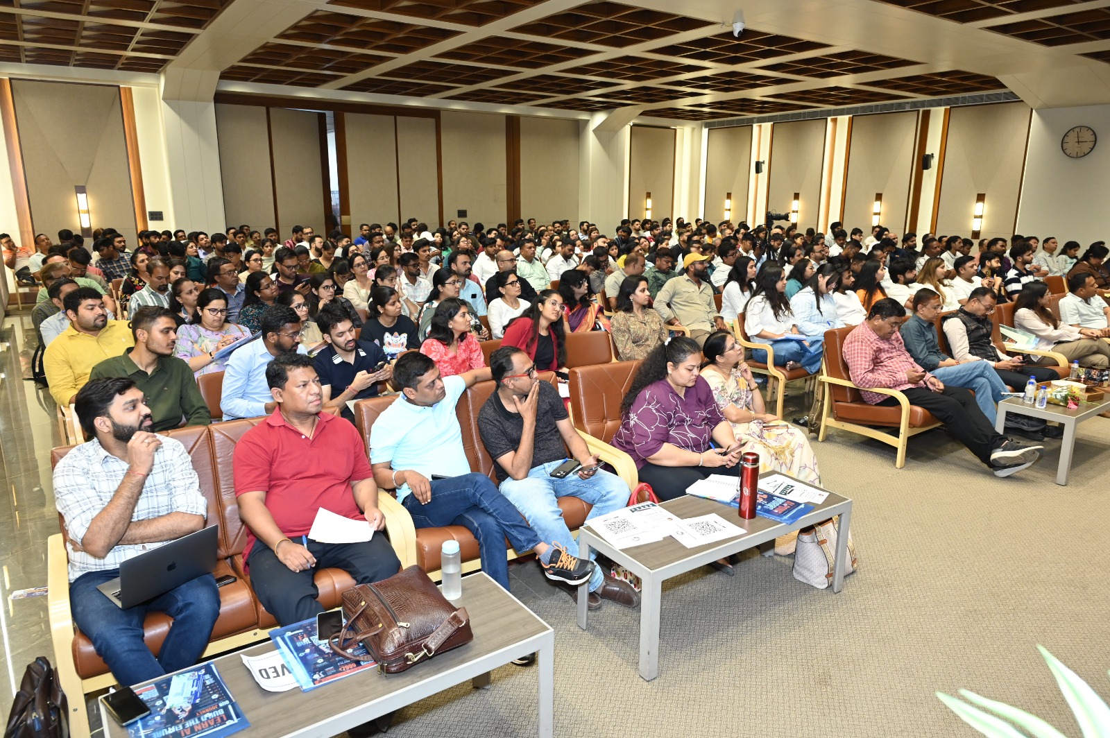 Attendees at a Lakshit Sethiya AI seminar with learning materials