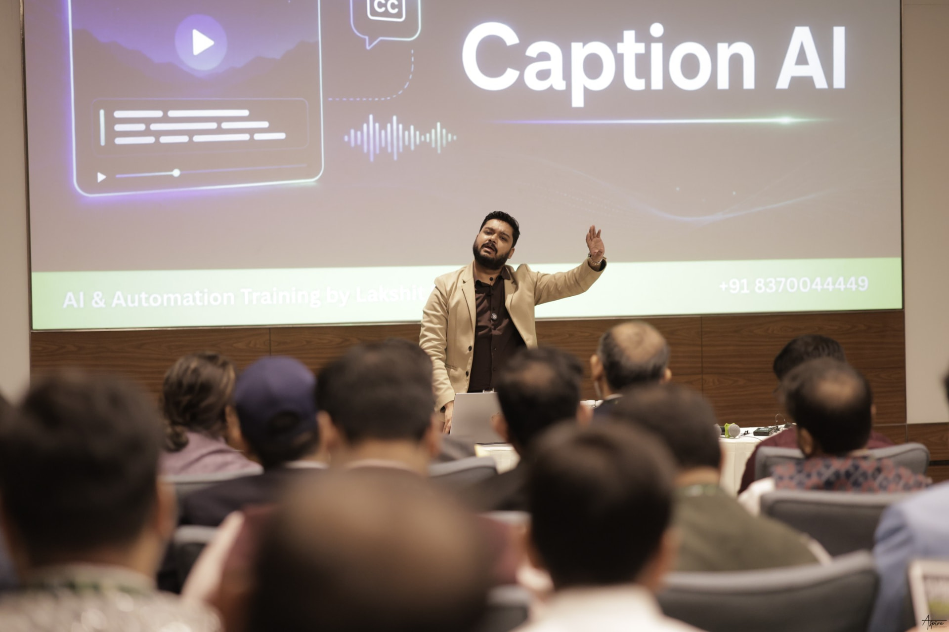 Lakshit Sethiya delivering an AI training with a projection screen